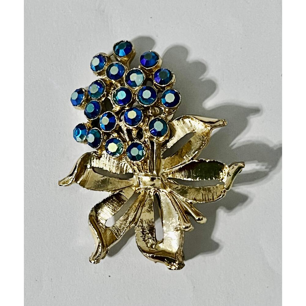 Blue-Green Rhinestone Flowers Bouquet Brooch Tied With A Bow In A Gold Tone